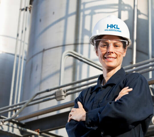 Female worker at an industrial plant HKL Anlagentechnik